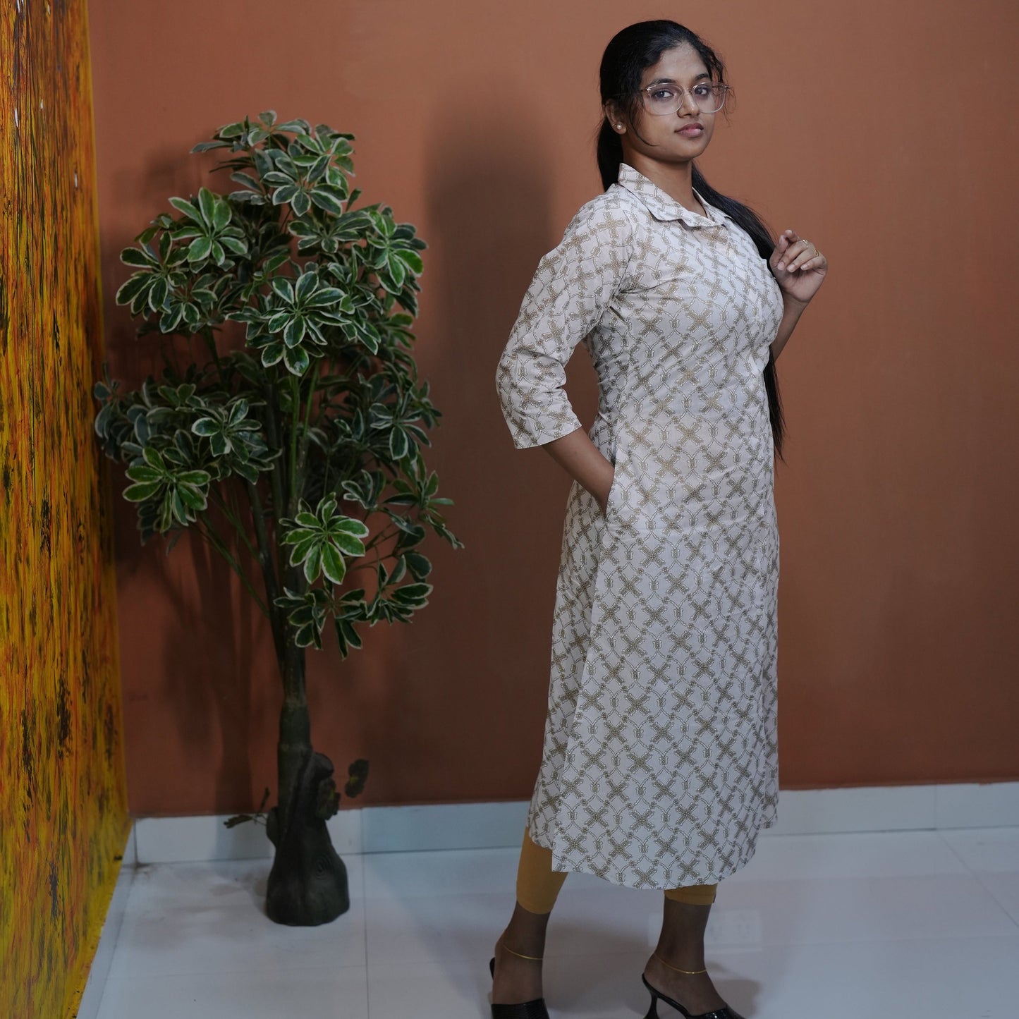 A-line cotton collared Kurti with side pocket best suited for Working Women.