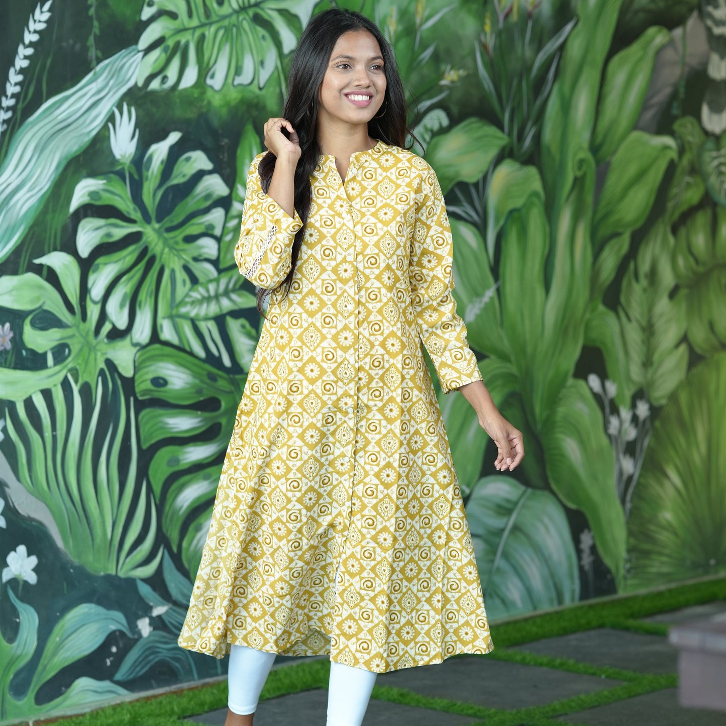A-line Mustard coloured Cotton Kurti with stylish lace sleeves.