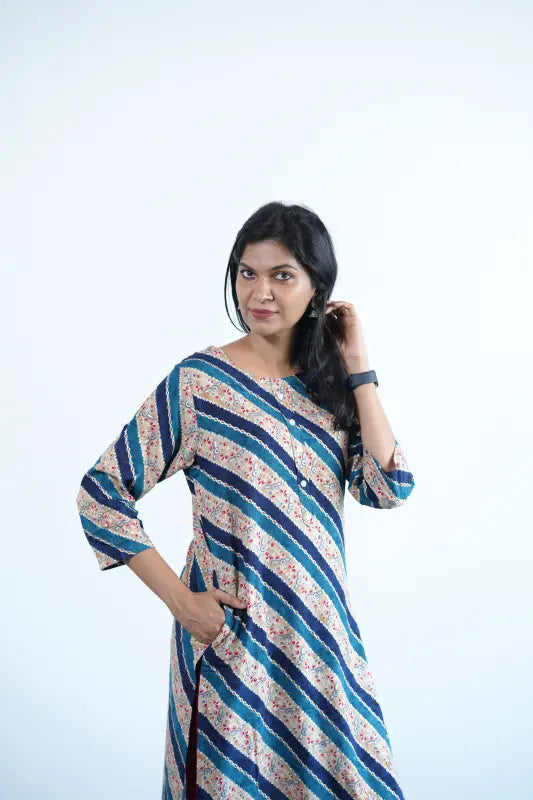 Simple straight cut tan coloured viscose rayon Kurti with turquoise green stripes and golden print work.