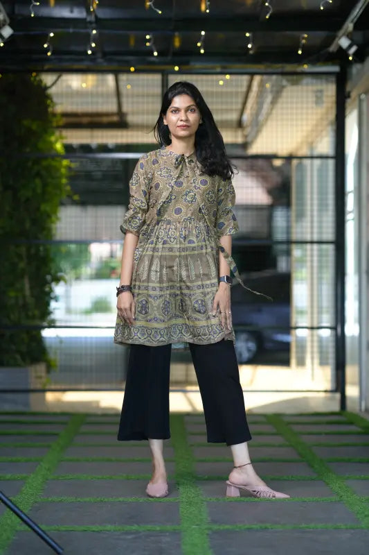 Classy army green colour short muslin silk kurti with stylish front tie detail.