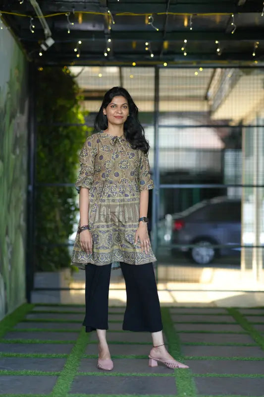 Classy army green colour short muslin silk kurti with stylish front tie detail.