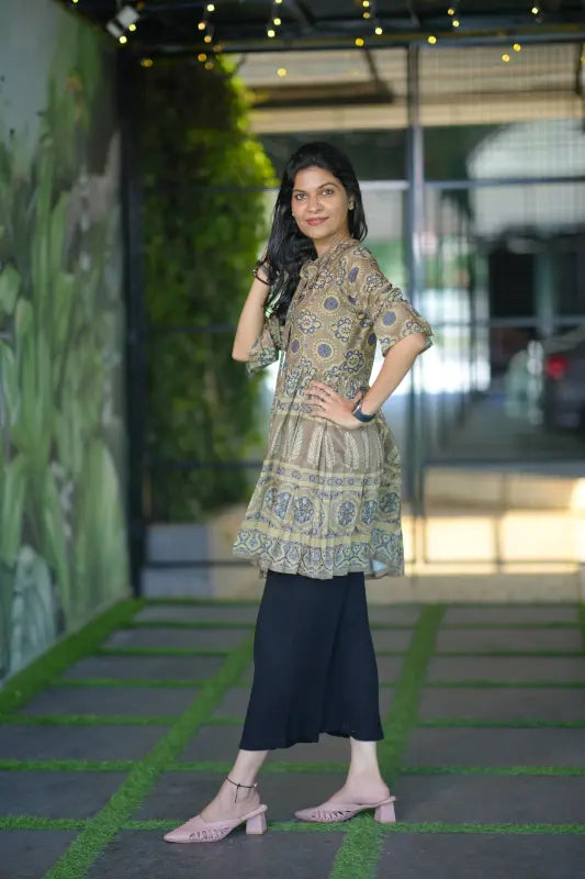 Classy army green colour short muslin silk kurti with stylish front tie detail.
