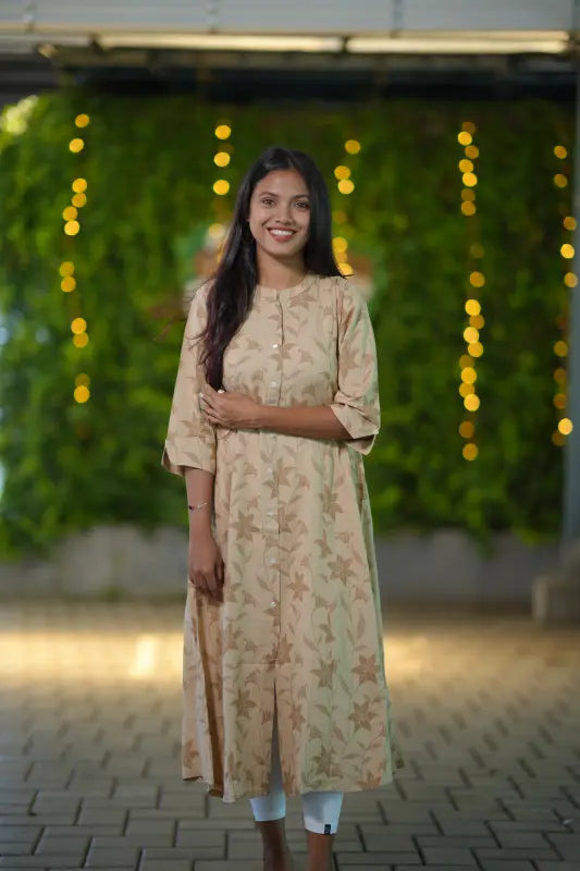 Simple beige color mandarin collared a line kurti.