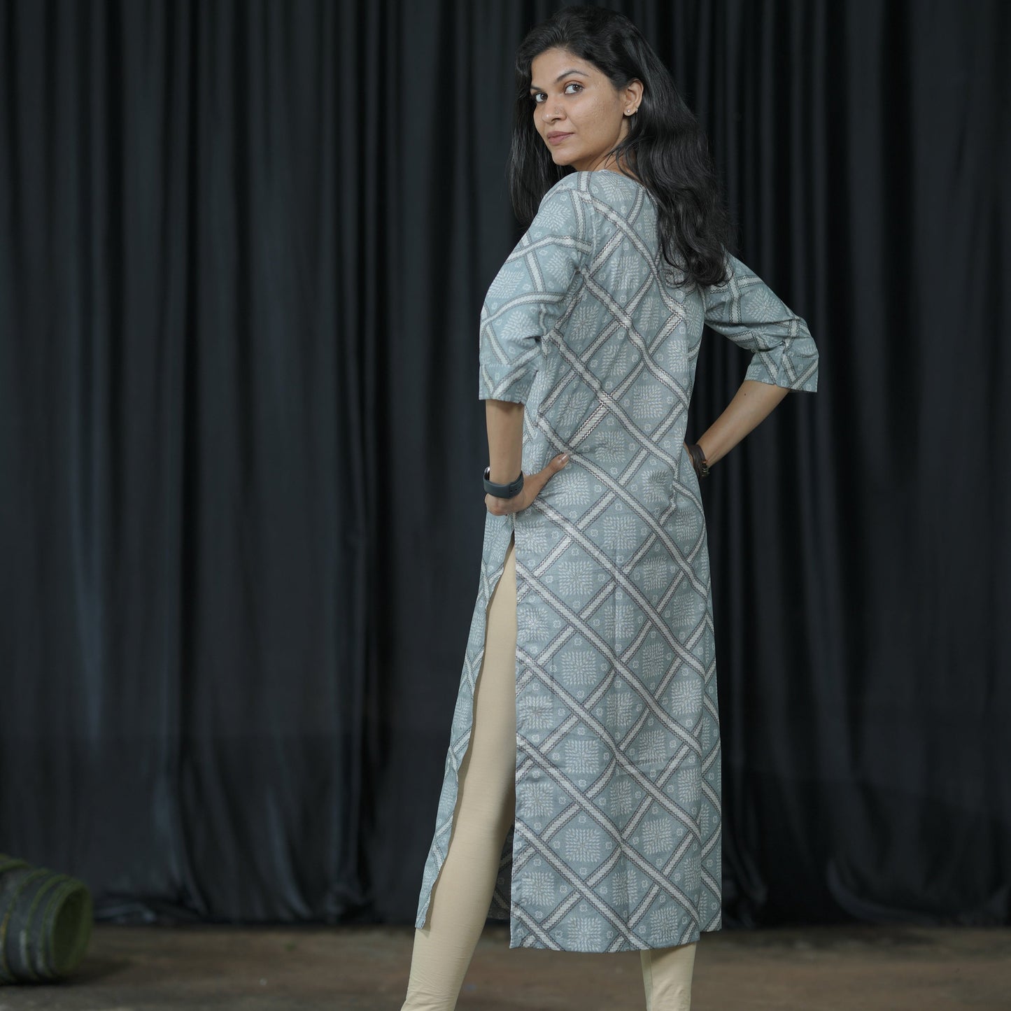 Straight cut ash grey coloured Cotton Kurti with golden print work.