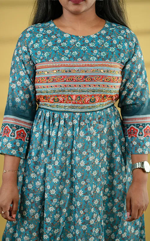 Deep teal color flared poly muslin kurti with mirror embellished yoke with back tie detail