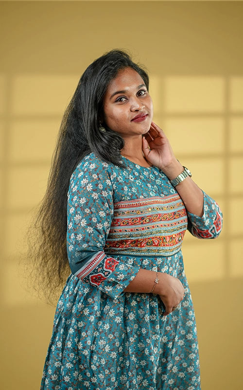 Deep teal color flared poly muslin kurti with mirror embellished yoke with back tie detail