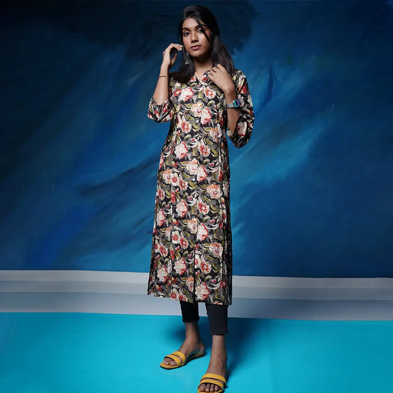 A-line princess cut rayon kurti with side pockets with floral design on a grey black base.