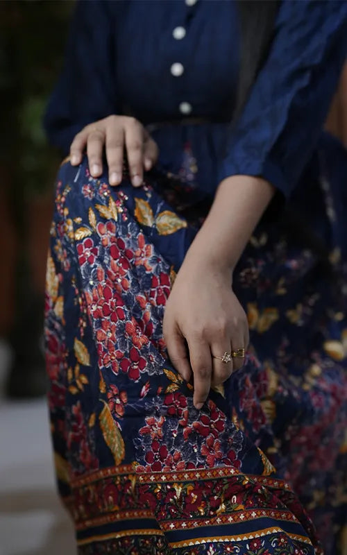 Flared navy blue dress style Kurti with embellished belt in rayon.