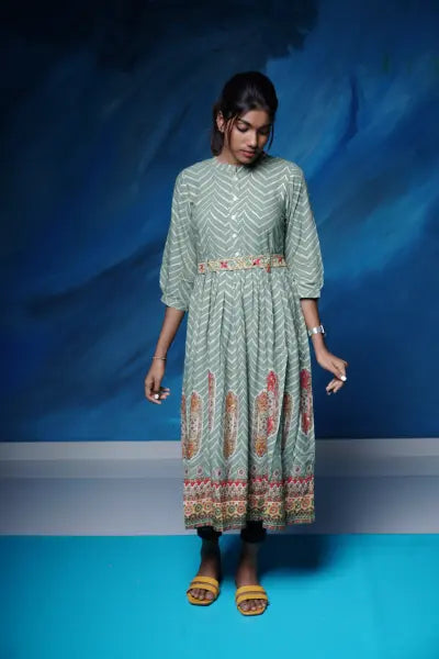 Lovely olive green rayon flared Kurti with embellished belt.