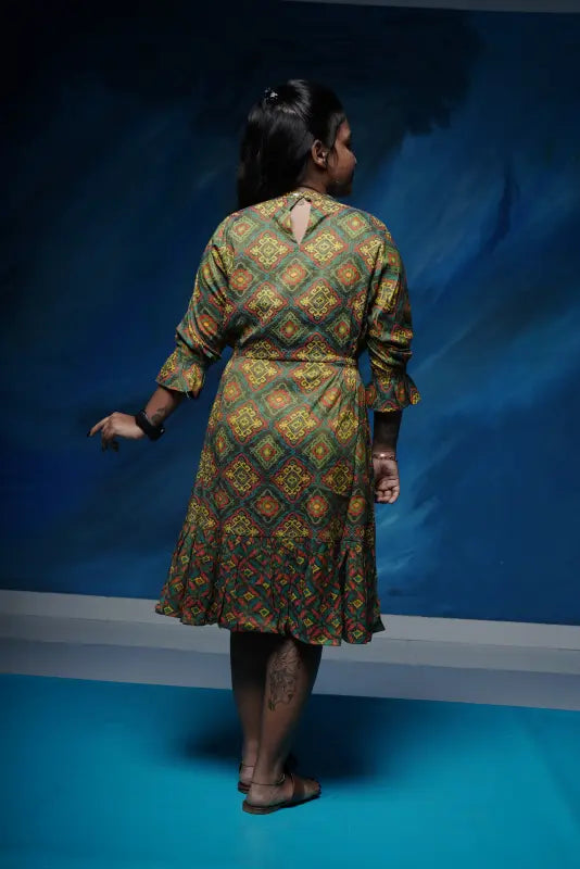 Flared short rayon Kurtis with an attached front tie in rich green colour with red and yellow work.