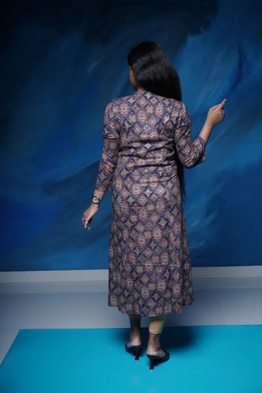 Collared rich navy blue A-line princess cut Kurti with golden print work in rayon.