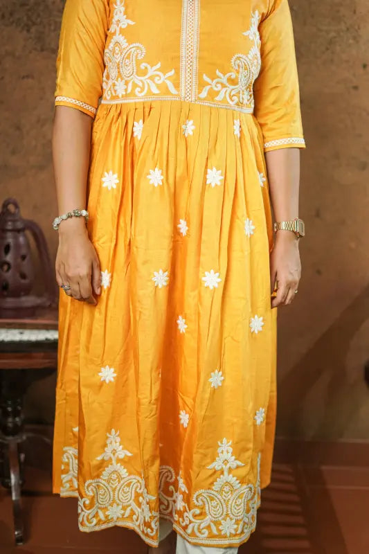 Lovely bright yellow flared Naira side cut silk Kurti with embroidery work.