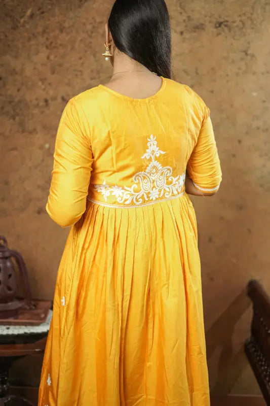 Lovely bright yellow flared Naira side cut silk Kurti with embroidery work.