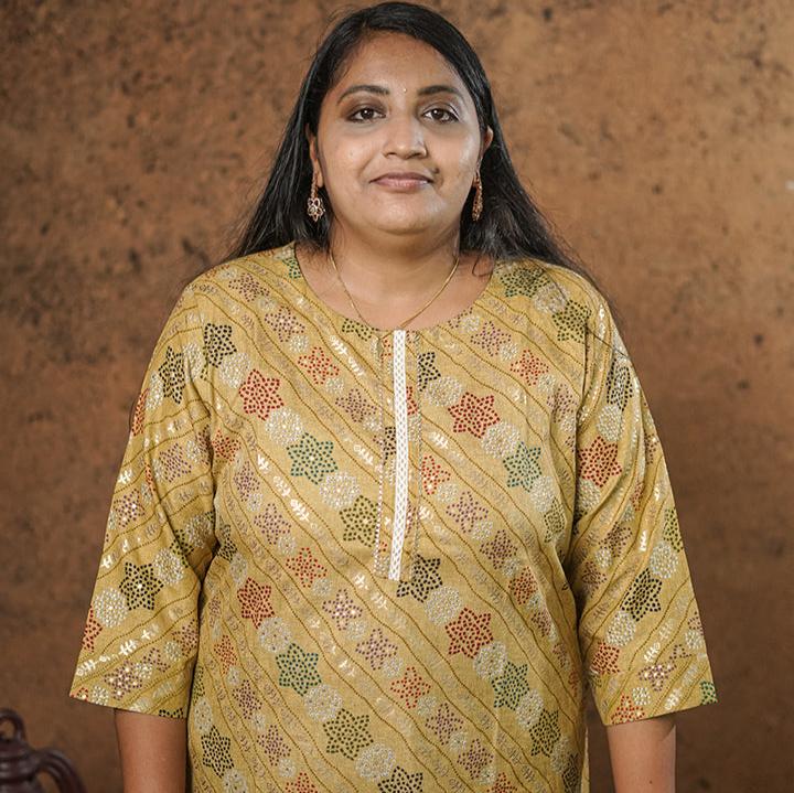 Deep mustard colour cotton Kurti with rich golden print work.