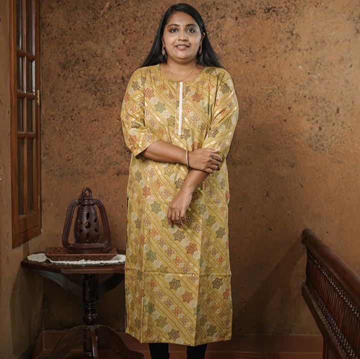 Deep mustard colour cotton Kurti with rich golden print work.