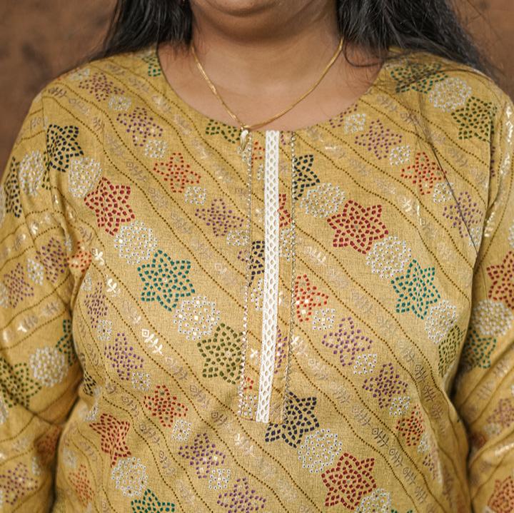 Deep mustard colour cotton Kurti with rich golden print work.
