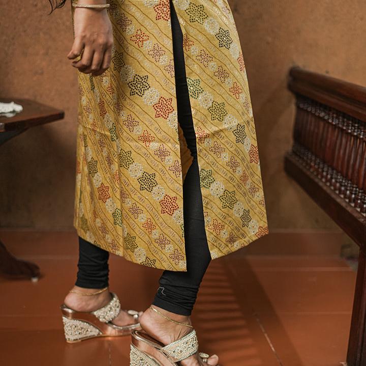 Deep mustard colour cotton Kurti with rich golden print work.