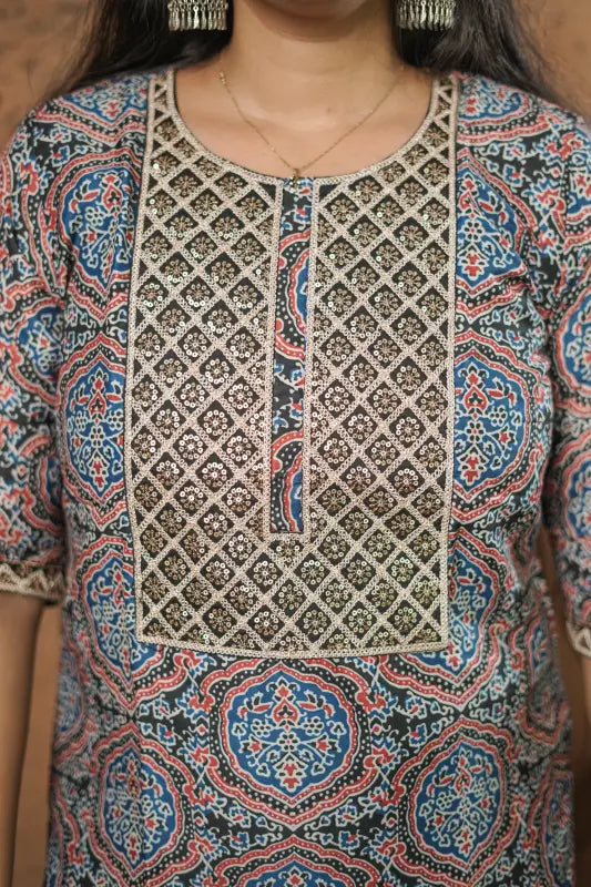 Lovely blue and red print on a black base with sequin embellished yoke muslin silk Kurti.