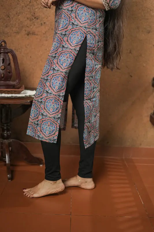 Lovely blue and red print on a black base with sequin embellished yoke muslin silk Kurti.