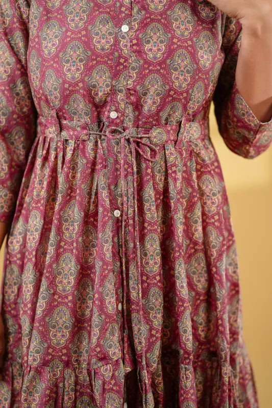 Gorgeous long flared gown style maroon muslin silk Kurti with print work.