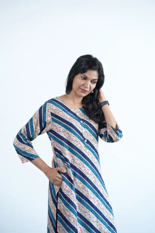 Simple straight cut tan coloured viscose rayon Kurti with turquoise green stripes and golden print work.