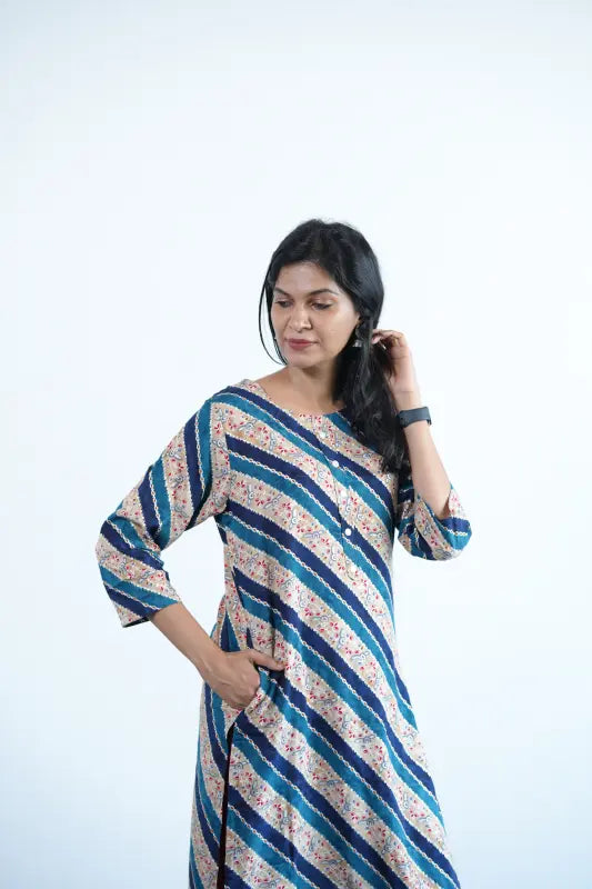 Simple straight cut tan coloured viscose rayon Kurti with turquoise green stripes and golden print work.