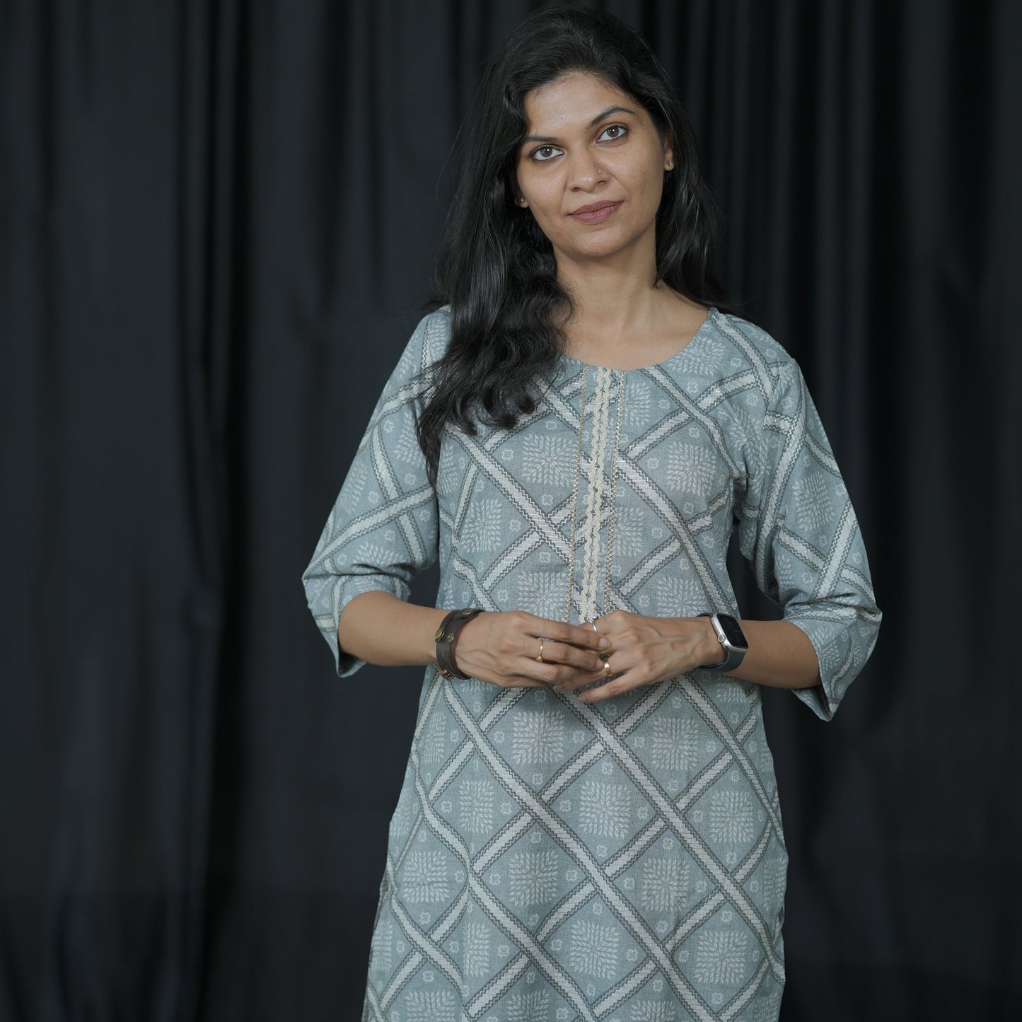 Straight cut ash grey coloured Cotton Kurti with golden print work.