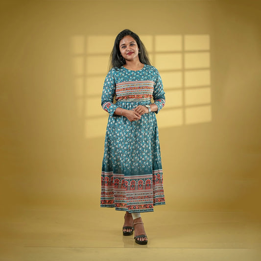 Deep teal color flared poly muslin kurti with mirror embellished yoke with back tie detail