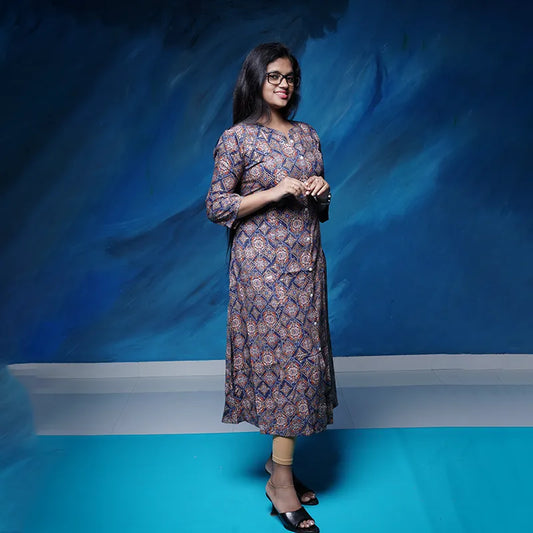 Collared rich navy blue A-line princess cut Kurti with golden print work in rayon.