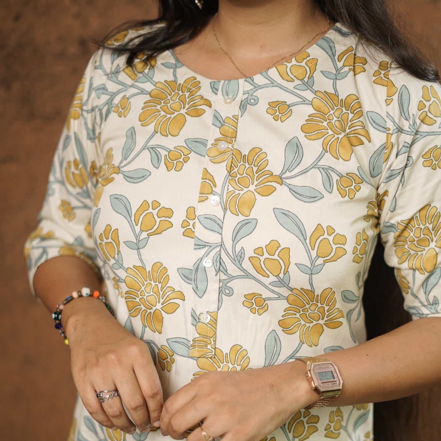 Simple off white cotton Kurtis with floral print.
