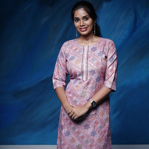 Pink pearl colour cotton Kurti with rich golden print work.