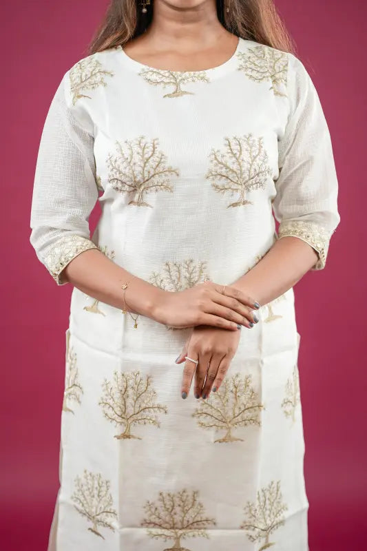 Beautiful and rich white and golden silk Kurti with rich golden thread work and golden tie dye Dupatta and rich golden stylish pant.