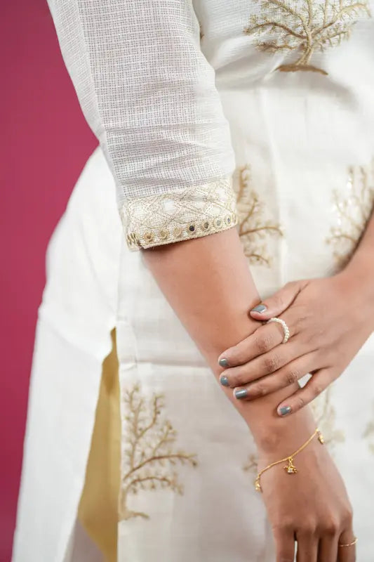 Beautiful and rich white and golden silk Kurti with rich golden thread work and golden tie dye Dupatta and rich golden stylish pant.