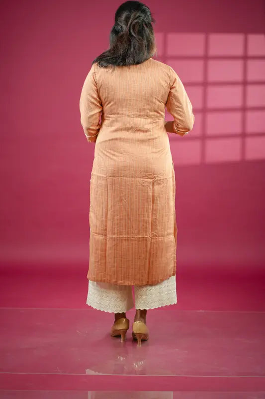 Rich caramel coloured straight side cut cotton silk Kurti with mirror and embroidery work.