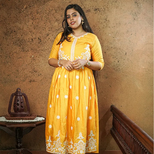 Lovely bright yellow flared Naira side cut silk Kurti with embroidery work.