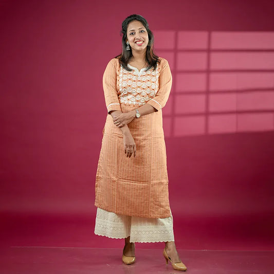 Rich caramel coloured straight side cut cotton silk Kurti with mirror and embroidery work.
