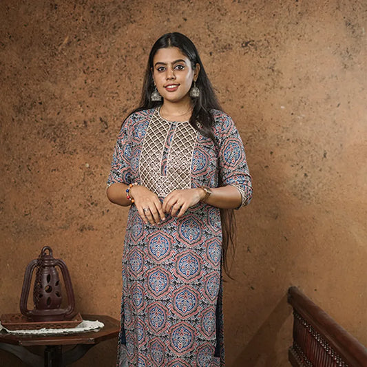 Lovely blue and red print on a black base with sequin embellished yoke muslin silk Kurti.