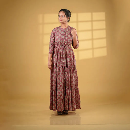 Gorgeous long flared gown style maroon muslin silk Kurti with print work.