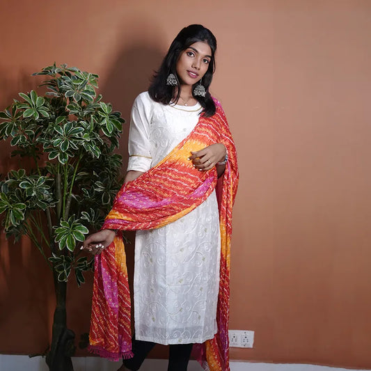 Rich white with embroidery and golden thread work Silk Kurti with bright red and yellow bandhej Dupatta.