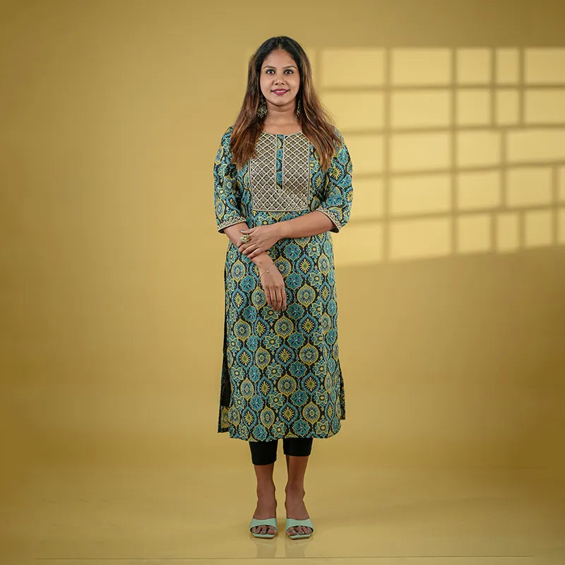 Ajrakh print black base muslin silk Kurti with mustard and turquoise print with added sequin embellished yoke.
